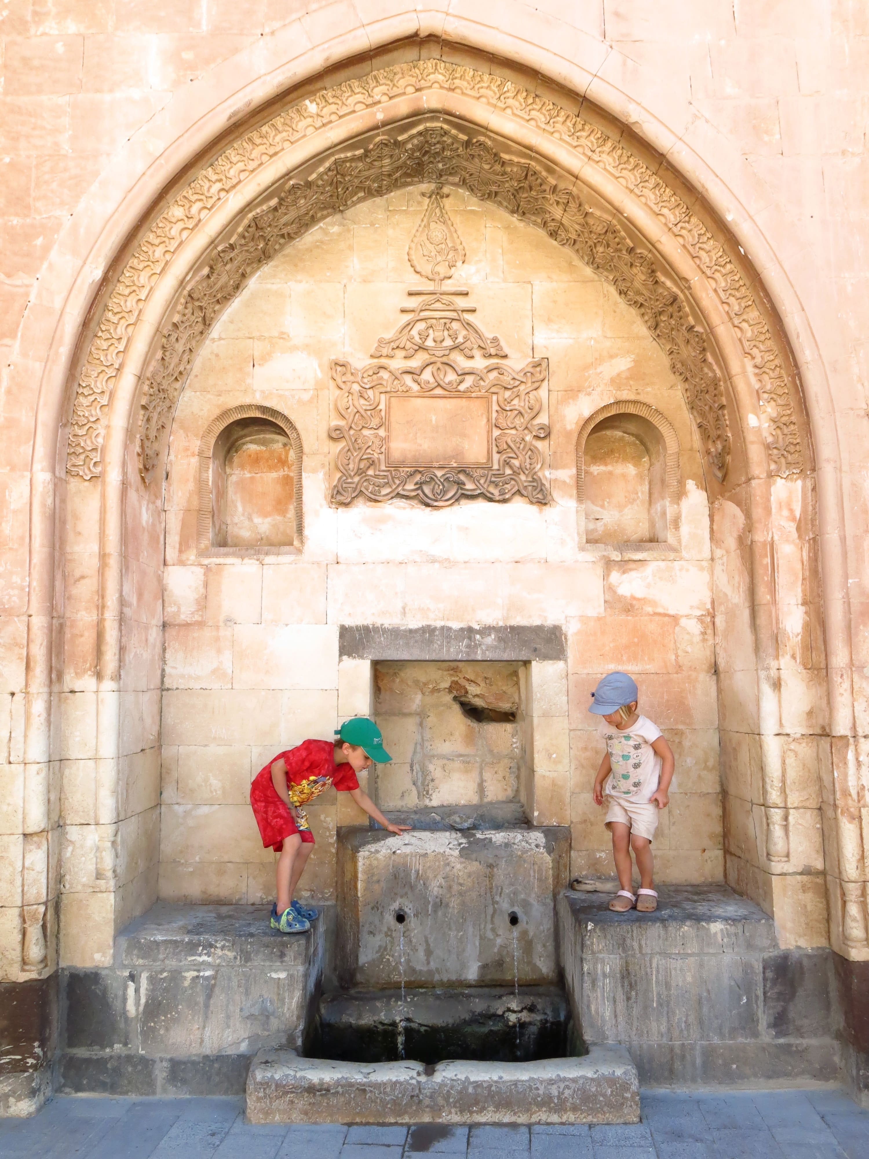 Vacation photo - kids playiong arround a fountain